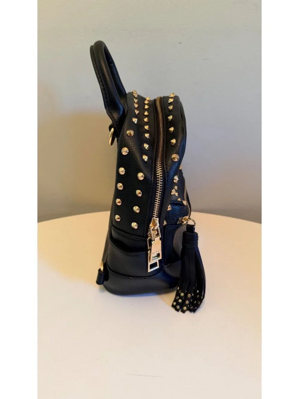 Bebe Black Mini Backpack Purse With Gold Studs & Tassel Accent